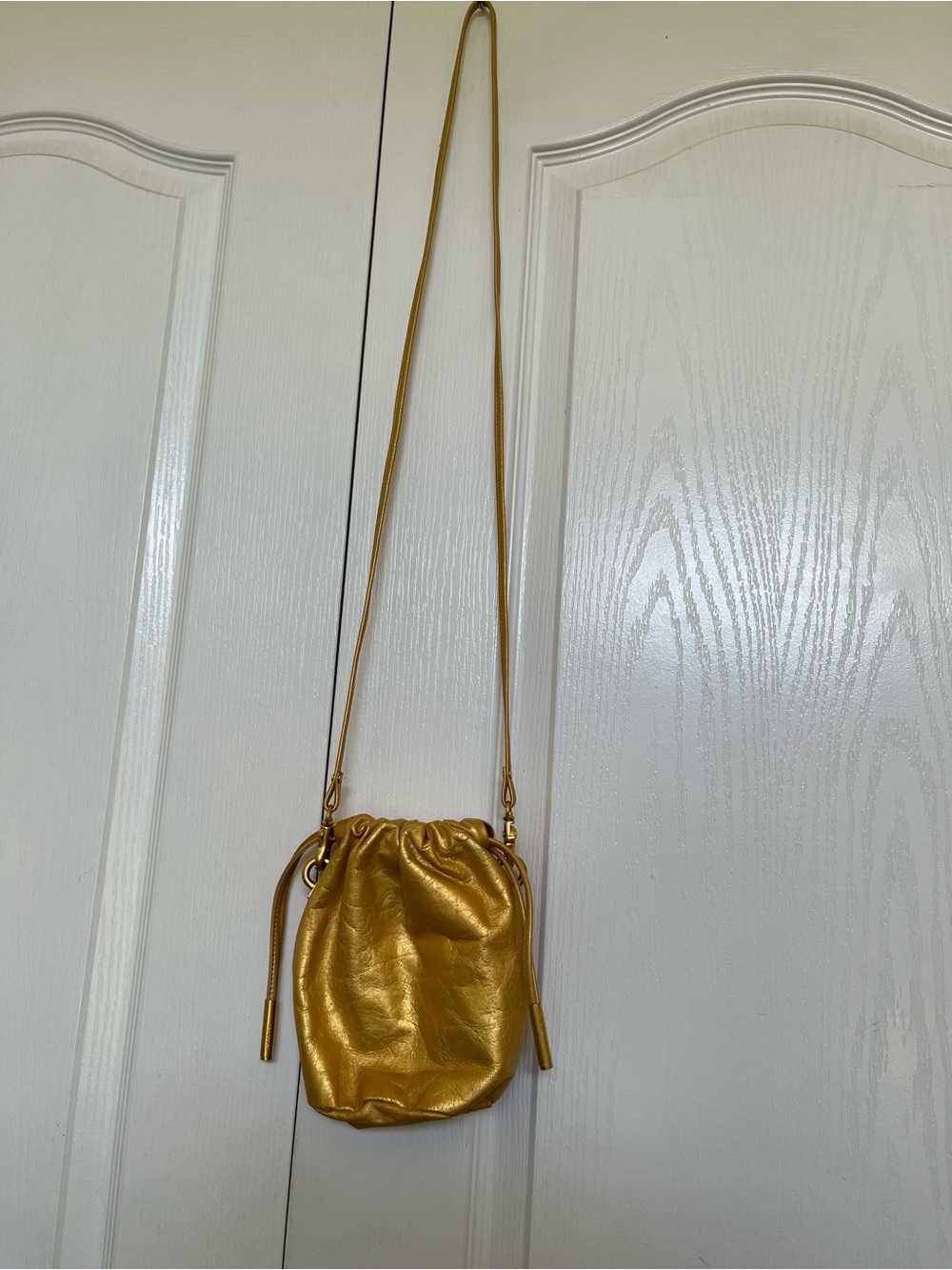 Sharif Metallic Gold Drawstring Crossbody